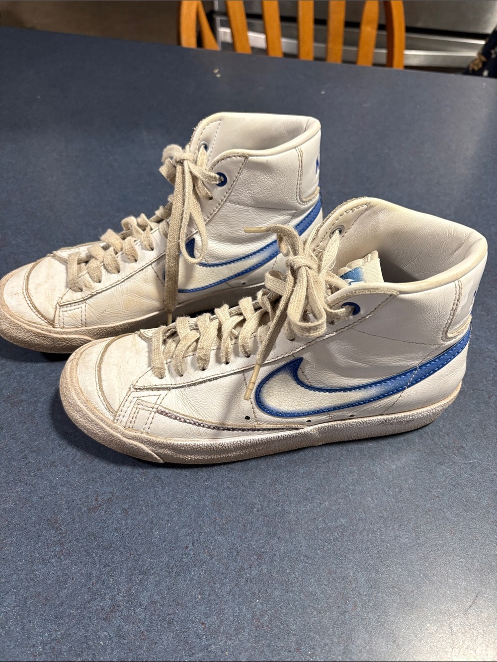 Nike High-Top Sneakers in White with Blue Swoosh